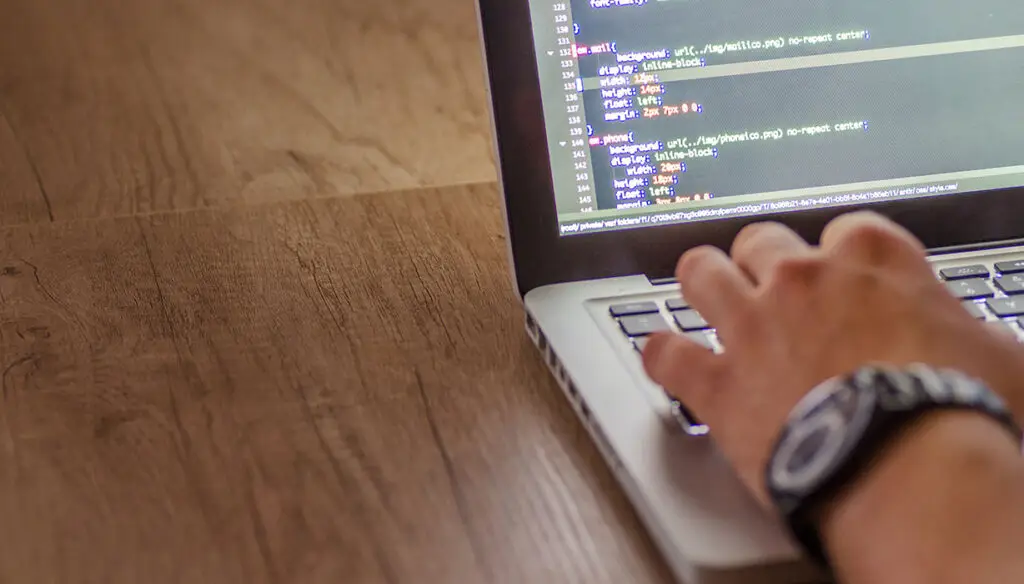 coding on a laptop