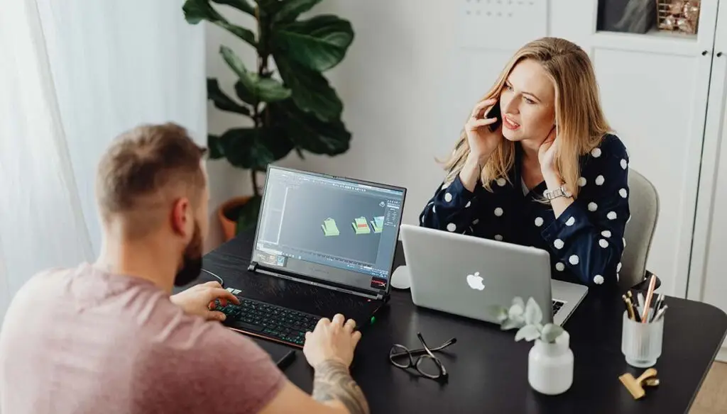 two workers discussing talent acquisition