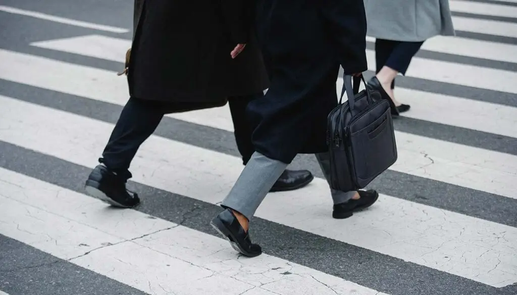 Office workers climbing steps