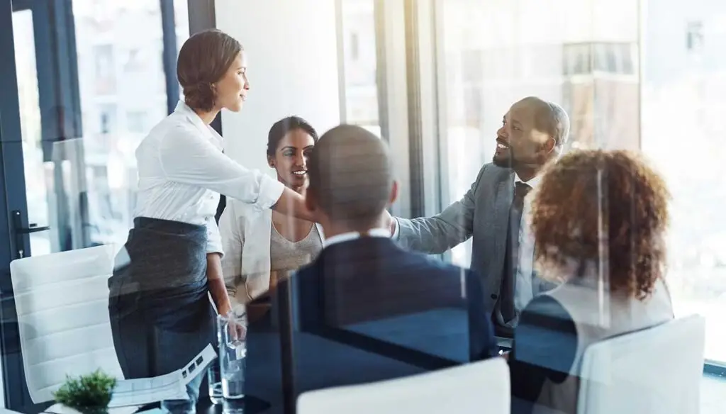 diverse group shaking hands