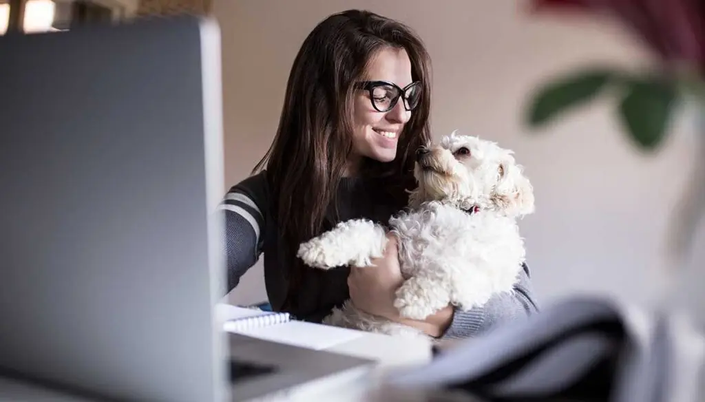 woman holding dog