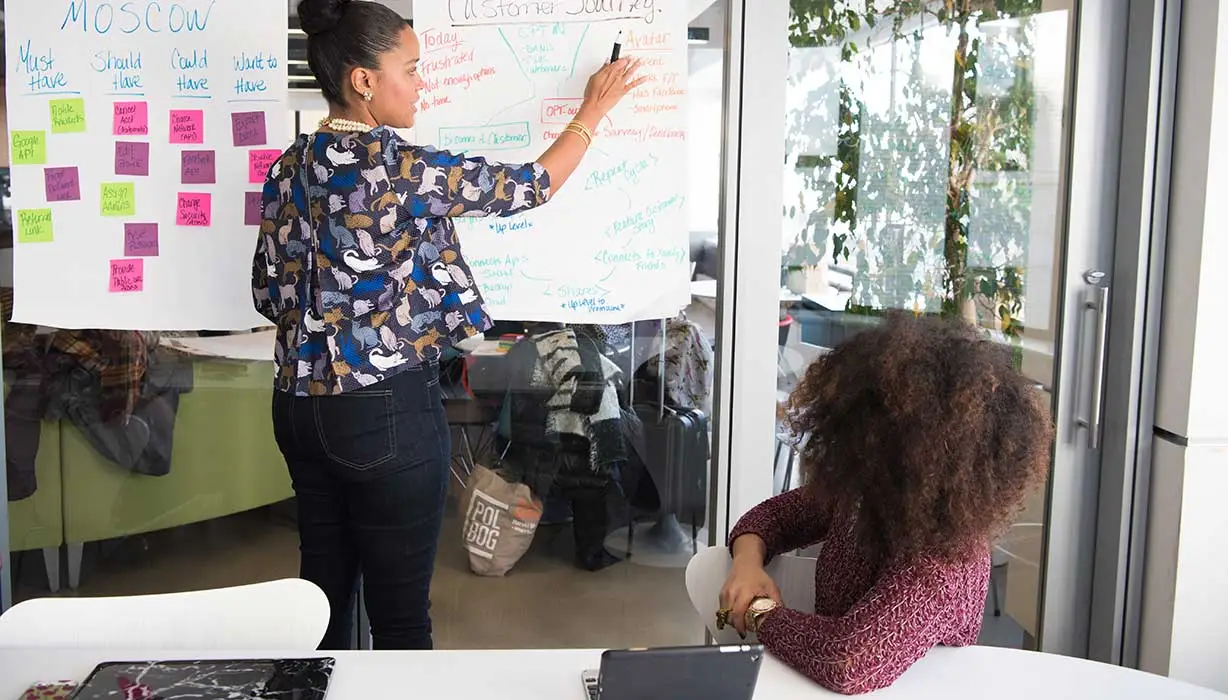 woman pointing at a chart