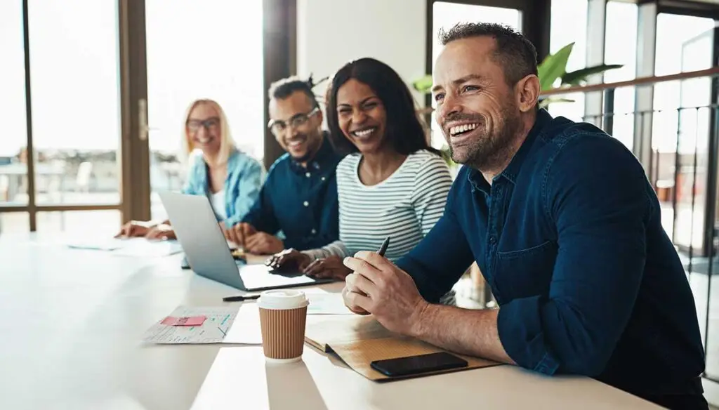 People in a conference room discussing recruitment trends