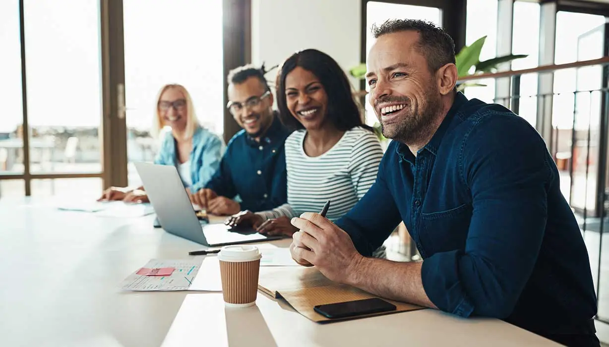 People in a conference room discussing recruitment trends