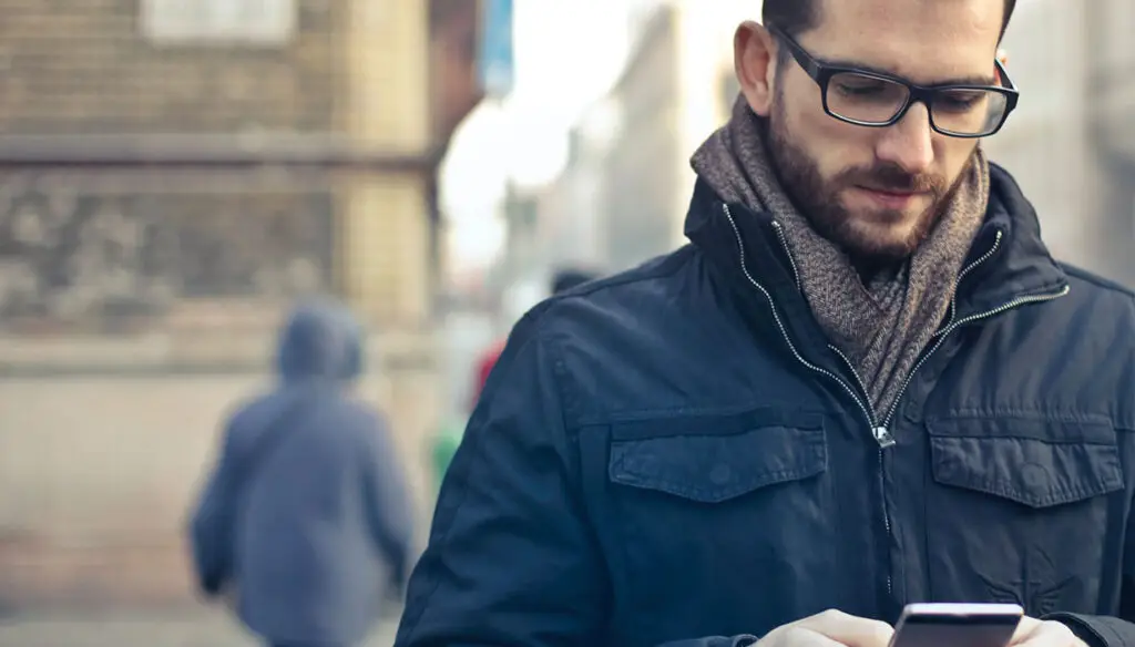 man on street using cellphone