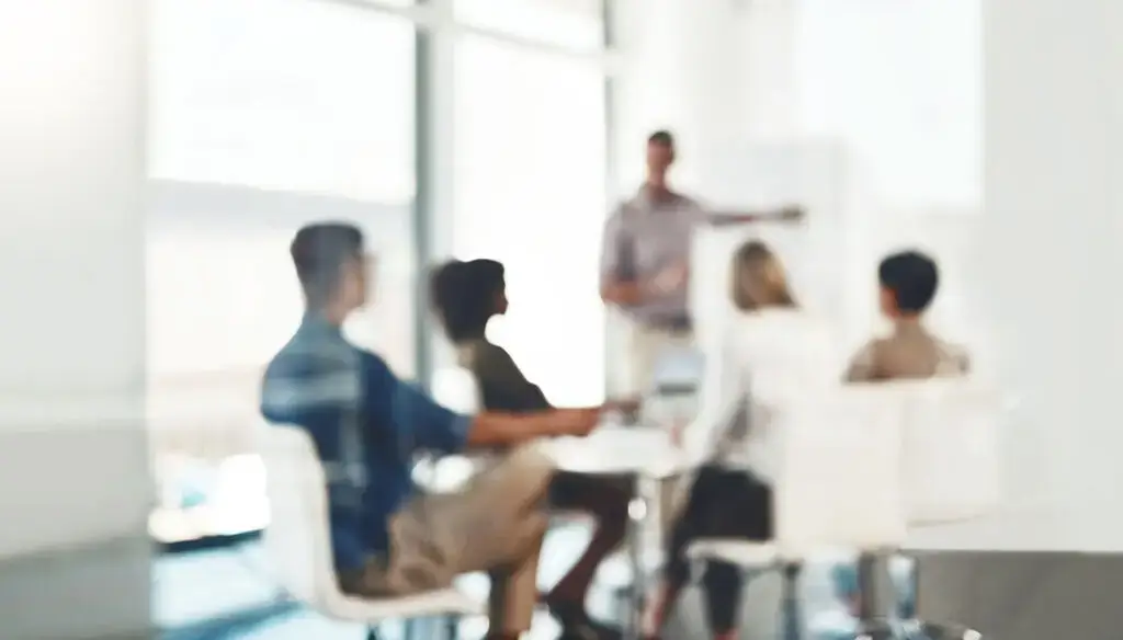 five people in office meeting