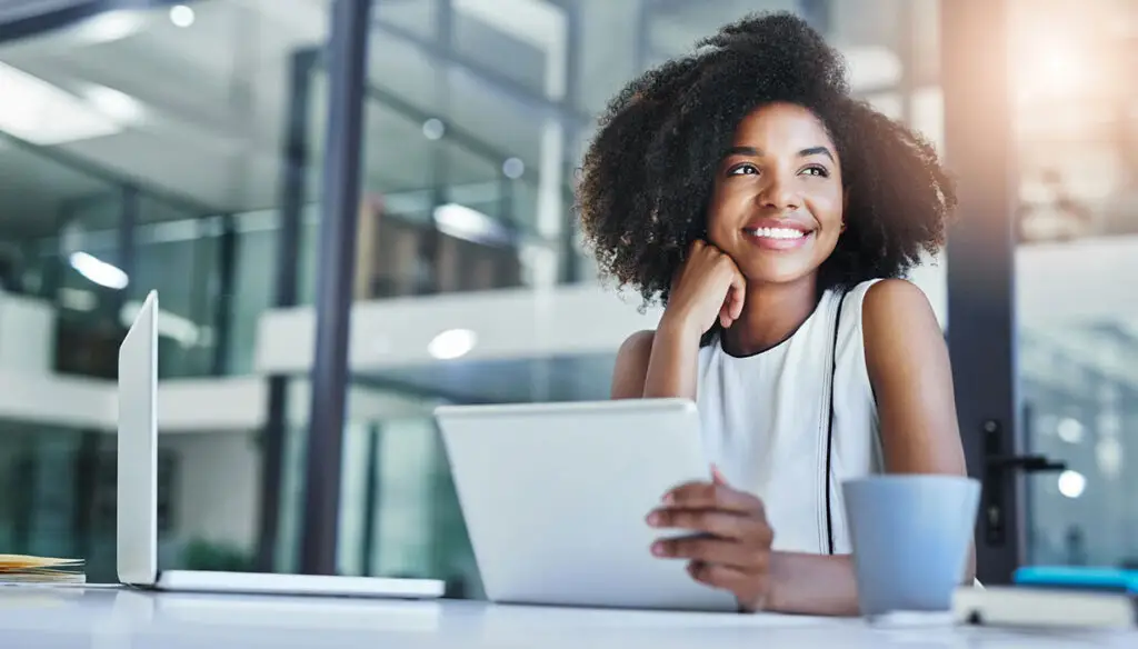 Smiling woman sitting at desk in an office