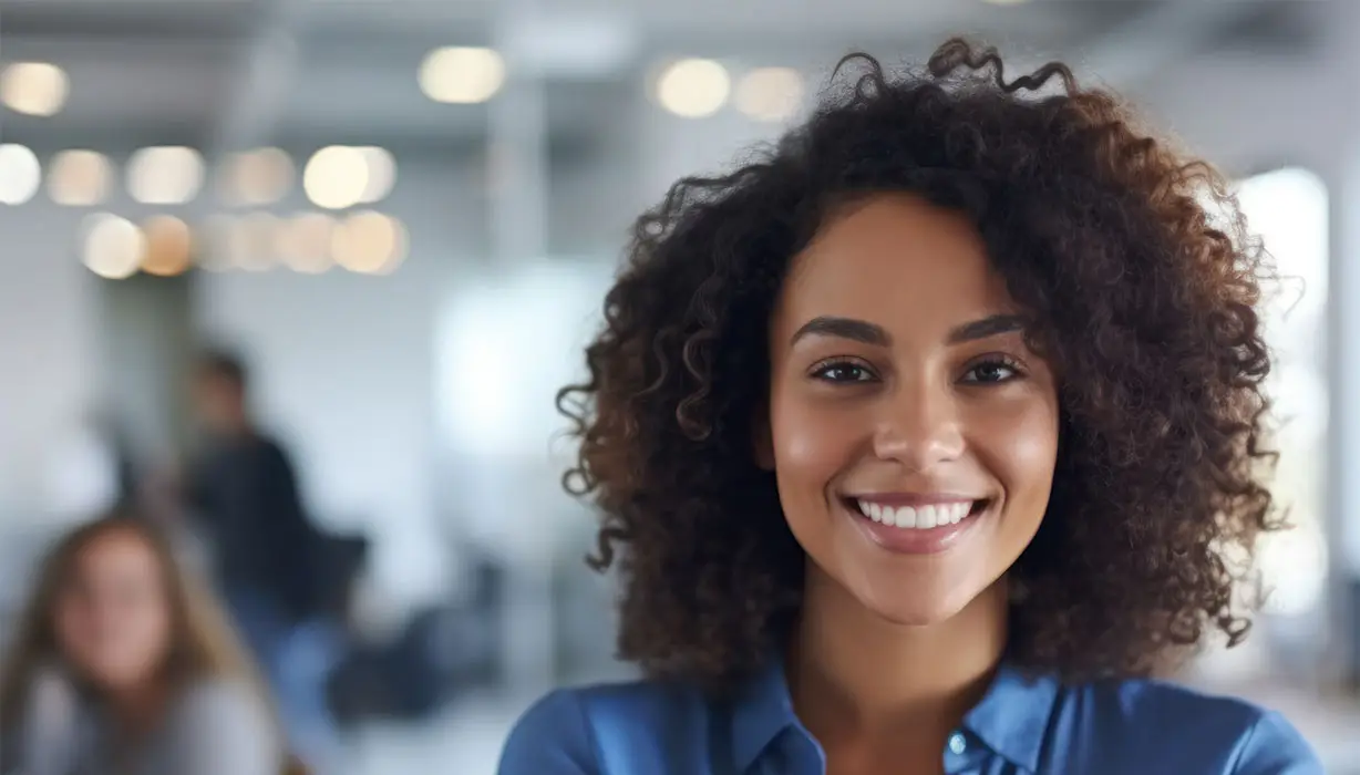 woman with blue shirt smiling