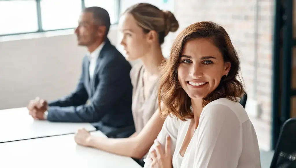 three people sitting at a table