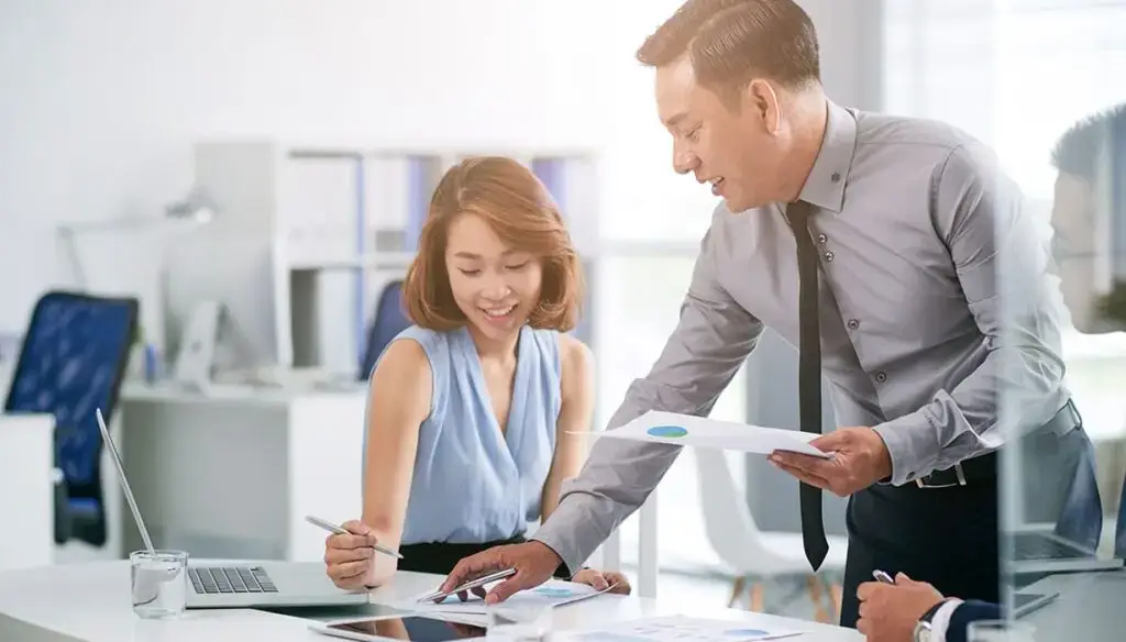 Two workers in an office